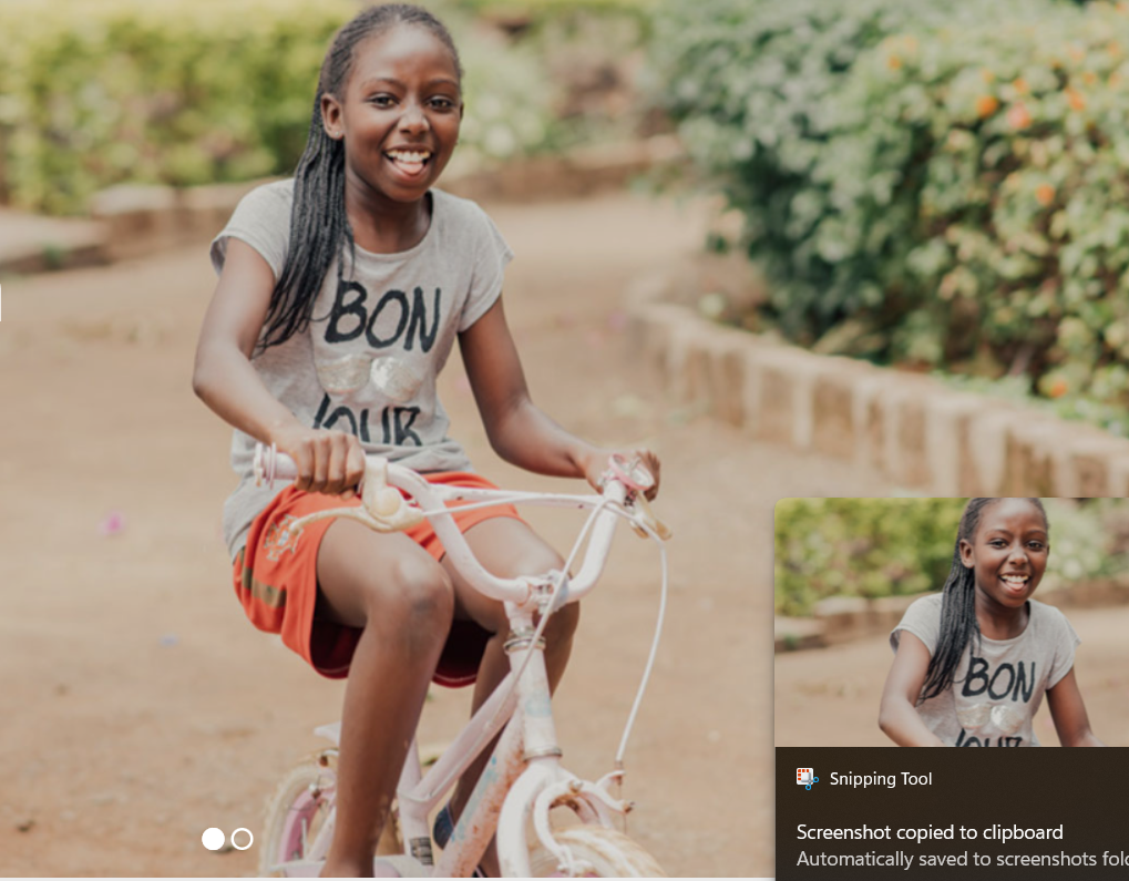 Girl riding a bike and smiling