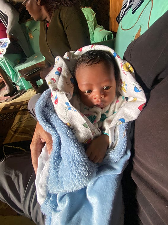 Newborn baby wrapped in a soft blanket